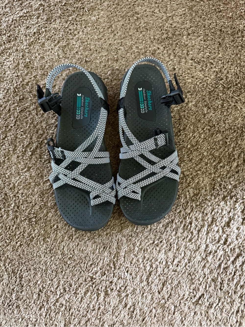 Skechers woman’s Black and White Strappy Sandals